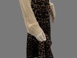an image of a mannequin wearing a skirt and blouse