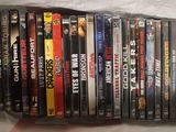 a lot of dvds in a plastic bag on a table