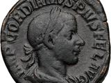 an old coin with a man ' s head on it