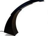 the black table lamp is on a white surface with a white background