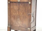 a small wooden cabinet with a drawer on top of it