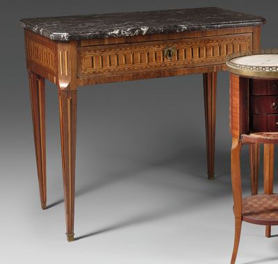 an image of a table with a marble top next to a chair