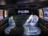 a view of the back seat of a car with a flat screen tv in the back