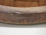 a close up of a wooden bowl on a table
