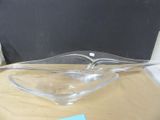 a glass bowl on a table with a note attached to it