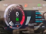 a close up of a car ' s dashboard with a speedometer