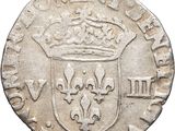 an old silver coin with a crown on top of it