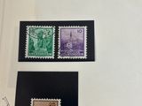 three different stamps are on a white surface with a black border