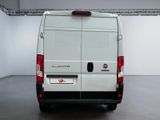 a white van that is parked in a room