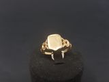 a gold ring with a white stone in the middle of it