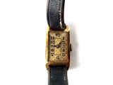 an image of a close up of a wrist watch on a white surface