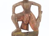 an image of a statue of a woman sitting on top of a rock