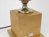 a lamp that is sitting on top of a wooden stand