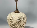 a lamp that is sitting on a table next to a lamp