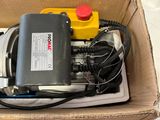 a box with a pump in it on a table