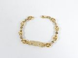 un bracelet plaqué or composé d'une barre et de perles