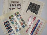 several different stamps and envelopes are on a table
