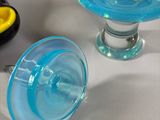 three glass vases sitting next to each other on a table