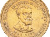 une vieille pièce de monnaie sur laquelle figure l'effigie d'un homme moustachu