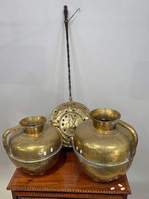 a gold vase on top of a wooden stand