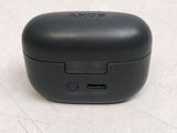 a close up of a small black device on a table