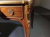 a small table with a drawer on top of it