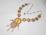 gold plated necklace with a yellow glass bead on a chain