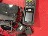 a red table with a bunch of electronics on top of it