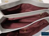a white purse that is open on a table