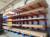 many shelves in the warehouse with boxes on them