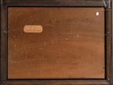 an old wooden box with a label on it sitting on top of a table