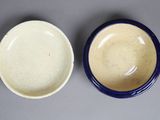two bowls sitting next to each other on a table