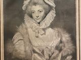 portrait d'une femme vêtue d'un manteau de fourrure et d'un bonnet, accompagnée d'un chat