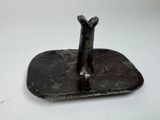 a small metal object that is sitting on a table