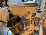 a mixer that is sitting on a counter in a kitchen