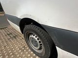 a white van that is parked on the side of the road