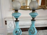 two lamps that are sitting on a marble table