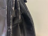 a black bag that is sitting on top of a table