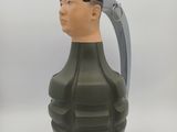 an image of a green grenade shaped vase with a man ' s head on it