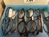 several pairs of glasses are in a blue box on a table