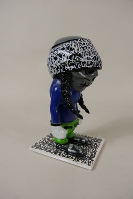 a small figurine of a person on a skateboard