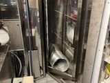 an image of a commercial kitchen with stainless steel appliances