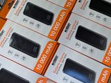 boxes of cell phones are stacked on top of each other in a store