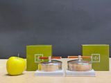 an apple and a stack of books on a table