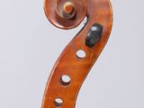 an old violin with a long neck and a long bow