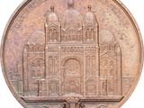 an old coin with a picture of a building on it