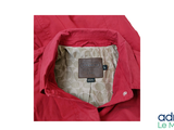a picture of a red jacket with a label on it