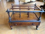 a bed with a wooden frame on a hard wood floor