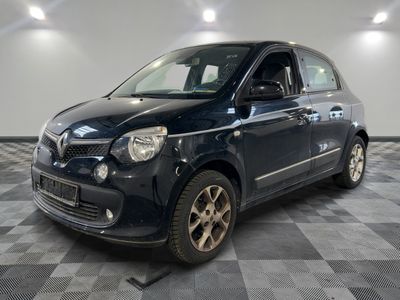 a picture of a small blue car parked in a garage