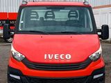 a red van that is parked in front of a building